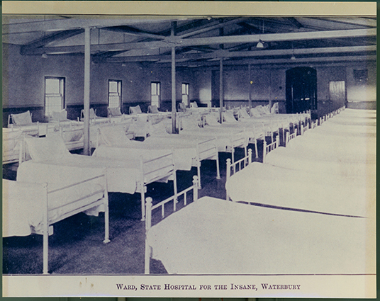 Photo of a ward from the state hospital. The caption reads State hospital for the insane.