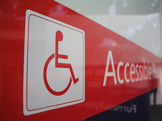 A sign, showing the disability access logo.