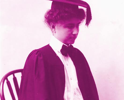 A colorized photograph of Helen Keller, wearing a graduation cap and gown.